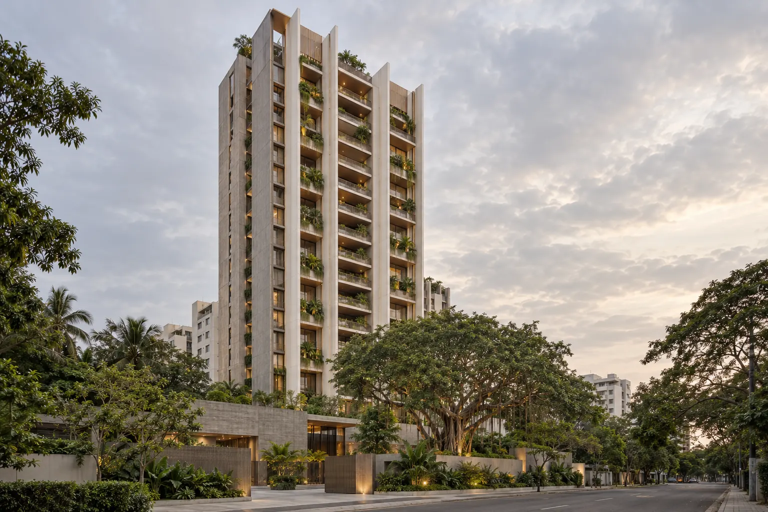 The Banyan, a 22-storey residential tower with off-white fins and planted balconies, seen from a tree-lined street in Adyar